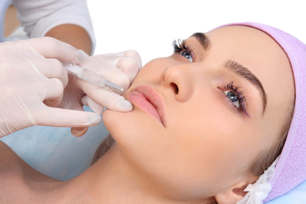 Person receiving lip injection.